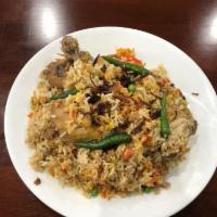 Chicken Biryani · Tender chicken cooked with basmati rice, onion, spice and herbs.