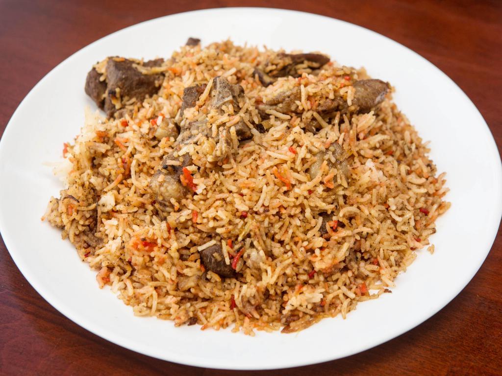 Goat Biryani · Tender goat meat cooked with basmati rice, onion, spice and herbs.