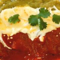 Enchiladas Tricolor · Four chicken enchiladas with red and green salsa, Mexican cream and cheese.