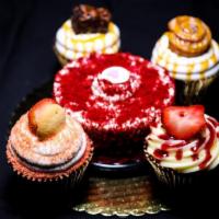 Party Pack- Mini and 4-Pack · 4 large cupcakes and a mini cake.
