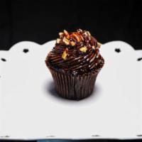 Choco Turtle Cupcake · 1 chocolate cake topped with chocolate buttercream icing pecan bits and chocolate and carmel...