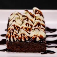 Cream Cheese Brownie · Rich and decandant chocolate brownie topped with cream cheese icing and chocolate drizzle.