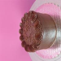 Nilla and Choco Mini Cake · Vanilla cake topped with chocolate buttercream icing.