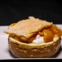 Cheesecake - Peach Cobbler · Original Cheesecake Round with a buttery graham cracker crust and peach cobbler topping.