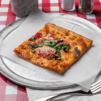 Grandma Pizza · Thin crust square pizza topped with homemade plum tomatoes sauce.
