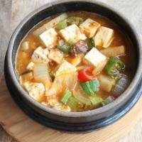 D8. Doenjang Jjigae · Bean paste soup with tofu and vegetable soup.	