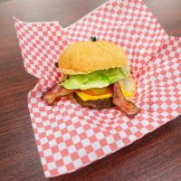 Hickory Cheese Burger · 1/4 lb. 100% beef patty, smoked bacon strips with lettuce tomato, onions and BBQ sauce.