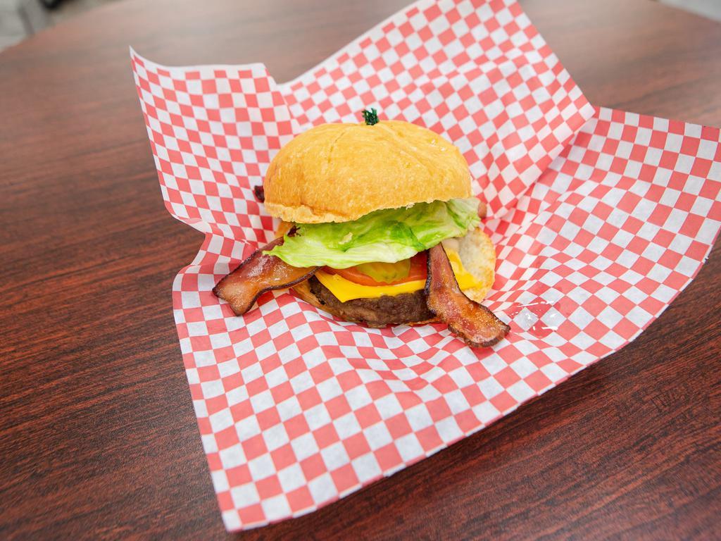 Hickory Cheese Burger · 1/4 lb. 100% beef patty, smoked bacon strips with lettuce tomato, onions and BBQ sauce.