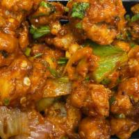 Cauliflower Manchurian · Cauliflower florets dipped in spiced batter, deep fried and sautéed with chopped onion, bell...