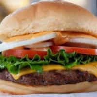 Cheeseburger · 1/3 lb. Angus beef patty, house sauce, lettuce, onions, tomatoes, pickles, and American chee...