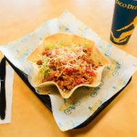 Taco Salad · Meat, beans, cheese, pico de gallo, and lettuce served in a grilled flour shell.