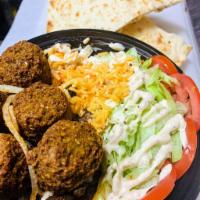 Falafel bowl · Served with rice, bread and salad.