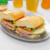 The Philly · Sweet and hot capicola, salami, provolone on a semolina hero topped with cherry peppers, pep...