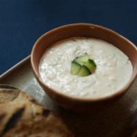 Tzatziki · Strained Greek yogurt, fresh cucumber, garlic, lemon juice and olive oil. (GF)