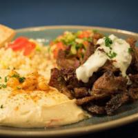 Lamb Shawarma Platter · Slow-roasted and marinated fresh lamb served over brown rice with a side of summer salad and...