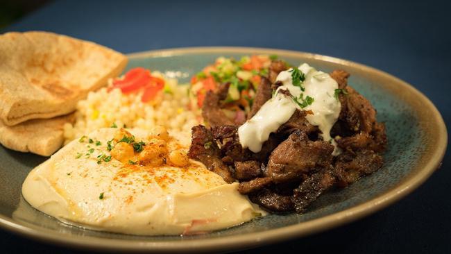 Lamb Shawarma Platter · Slow-roasted and marinated fresh lamb served over brown rice with a side of summer salad and your choice of a dip or spread. Served with warm pita and Garlic Aioli.