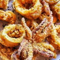 Fried Calamari · Lightly floured and fried, served with homemade marinara sauce and lemon.