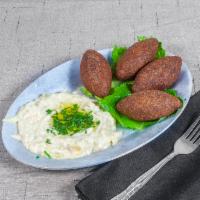 4 Fried Kibbeh · Ground meat, bulgur wheat and various flavorings.