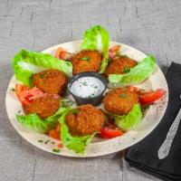 6 Falafel · Chickpeas, fava beans, cilantro grounded and mixed with spices and deep fried served with ta...