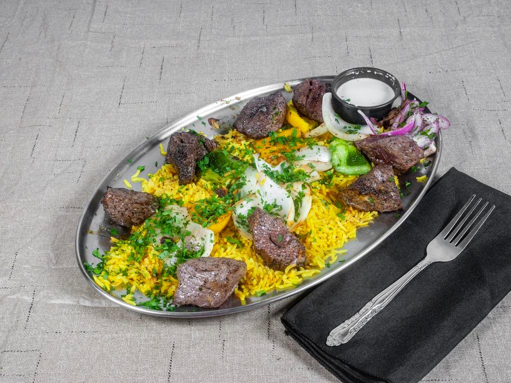 Beef Kabab · Two 4 oz. skewers of tenderloin marinated and grilled with vegetables served with rice, pita bread and garlic tahini sauce.