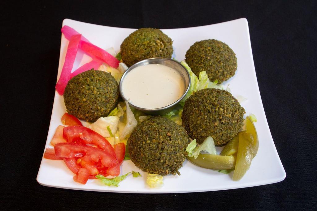 3. Falafel  · Vegan. Gluten Free. 5 Pieces. Chickpeas ground with garlic, spices and parsley then deep fried.