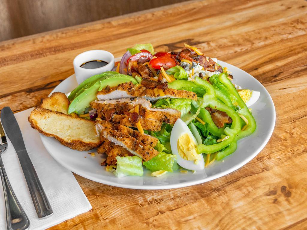 Cobb Salad · Romaine lettuce, chicken, bacon, blue and cheddar cheese, tomato, egg, avocado, red onion, green pepper and choice of dressing.