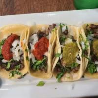 My sampler tacos  · 4 tacos to taste cilantro onion lemon    the small tacos just cilantro and onion.  large tac...