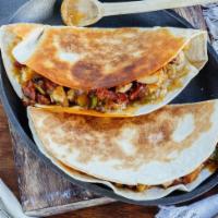 QuesadillasFlour tortilla  · 12 quesadillas with meat to taste and guacamole cheese 