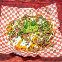 Nara Carne Asada Fries · French fries, carne asada, guacamole, sour cream, cheese. Served with nara sauce.