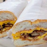 Sausage, Egg and Cheese Hero · A long sandwich on a roll. 