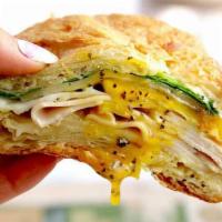 Turkey, Egg and Cheese Hero · A long sandwich on a roll. 
