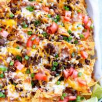 Ground Beef Nacho's · Ground Beef , Sour cream, beans, lettuce , melted cheese, pico de Gallo