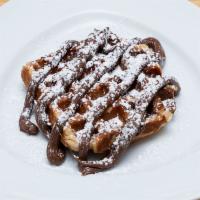 Liege Nutella Waffle · Caramelized sugar outside and slightly doughy inside, this waffle is a wonderful snack. Topp...