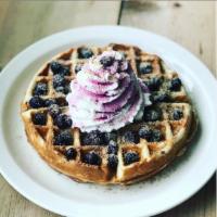 Cobbler Waffle · Belgian waffle with blueberries, streusel and whipped cream. Served with maple syrup and hom...