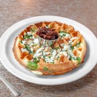 Hummingbird Waffle · Belgian Waffle stuffed with spinach and topped with mixed nuts and goat cheese. Served with ...