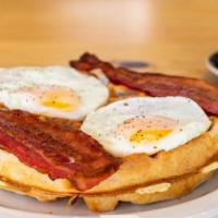 Traditional Waffle, Bacon and Eggs · Traditional Belgian Waffle, eggs, and bacon. Served with maple syrup and butter. 
