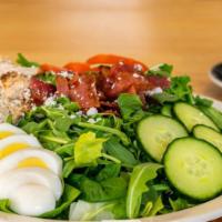 Cobb Salad · Lettuce, spinach, arugula topped with chicken, bacon, cucumbers, tomatoes, boiled egg and ba...