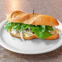 Chicken Pesto Sandwich · Chicken, pesto, swiss cheese, artichoke hearts, spinach, and onions on 
poor boy bread.