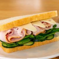 Turkey Sandwich · Turkey, cucumber, swiss cheese, spinach, and honey mustard on sourdough bread.