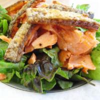 Salmon Skin Salad · Toasted crispy salmon skin with balsamic vinaigrette.