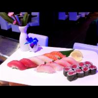 Sushi Deluxe · 10 pieces of assorted sushi and tuna roll. Served with miso soup or green salad.