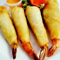 Blanket Shrimp  · Shrimp crispy spring rolls with cabbage and carrots. Served with sweet chili sauce.