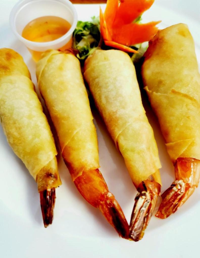 Blanket Shrimp  · Shrimp crispy spring rolls with cabbage and carrots. Served with sweet chili sauce.