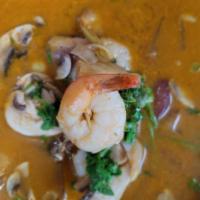 Tom Yum Goong Soup · Hot and sour shrimp soup, spiced with lemongras, galamgal, cilantro, scallions, lime juice a...