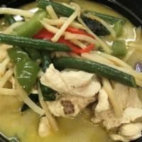 Green Curry · Green curry with coconut milk, bell peppers, bamboo shoots, string beans, eggplant and basil.