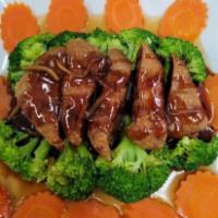 Home Style Duck ·  Crispy roasted duck with broccoli, carrots and ginger in tamarind sauce.