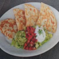 Quesadillas · Cheese, meat of choice, pico de gallo, lettuce, guacamole, and sour cream.