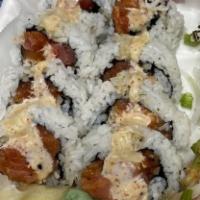Inside Out Roll · Tuna, salmon, spicy tuna, mayo crab, with spicy mayo, unagi sauce, shredded onions.