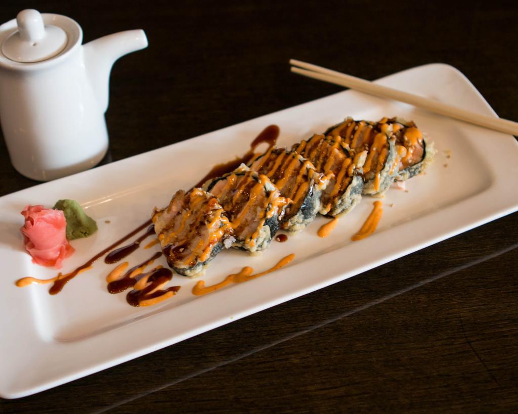 Godzilla Roll · Batter fried. Roll of tuna, salmon, yellowtail and rice with special spicy sauce.