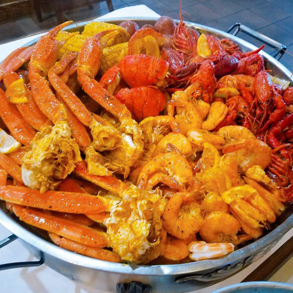 4 PPL Combo Special · Fried shrimp (10), fried calamari, 2 lb. shrimp (no head), 2 lb. snow crab leg, 2 pieces lobster tail, 2 lb. crawfish 4, corns and 8 potatoes.